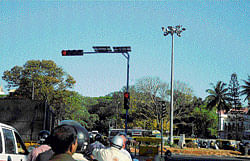 Re-installed traffic signal light poles at K R Circle. DH Photo