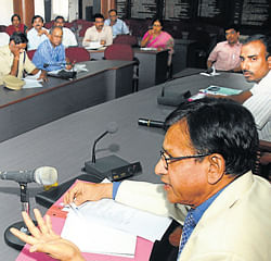 (Left) SHRC Member C G Hungund chairing an officials     meeting at DC office in Mangalore on Friday. Additional Deputy Commissioner Dayanand among others looks on.