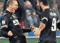 Juventus Girogio Chiellini (left) celebrates with Mirko Vucinic after scoring against Napoli during their Serie A clash on Friday night. AP
