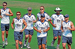 England cricketers warm-up ahead of their practice session at the Eden  Gardens in Kolkata on Sunday. pti