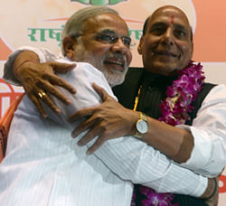 Bharatiya Janata Party (BJP) senior leader and Chief Minister of Gujarat, Narendra Modi (L), hugs BJP President Rajnath Singh during a BJP National Council two day meeting in New Delhi on March 2, 2013. Amid calls for a larger role for him Modi won singular praise from BJP President Singh for being the 'most popular' chief minister having registered 'never before' three consecutive electoral wins for the party in Gujarat. In a poll published in January, 36 percent of voters surveyed said Modi would make the best prime minister -- well ahead of his likely election rival Rahul Gandhi of the ruling Congress party who had just 22 percent. AFP PHOTO