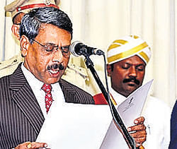 Justice Subhash B Adi takes oath as Upalokayukta on Saturday. DH Photo