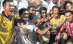 Services players celebrate their triumph over Kerala in the Santosh Trophy football tournament on Sunday.