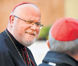 German Cardinal Reinhard Marx (L) arrives for a meeting at the Synod Hall in the Vatican on Monday to deliberate on election of Roman Catholicisms new leader. reuters