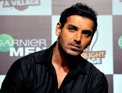 Bollywood actor John Abraham poses during a social campaign event in Mumbai on March 5, 2013. AFP PHOTO