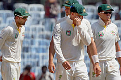 Chennai: Australian skipper Michael Clarke walks back to pavilion with his teammates after the end of the first test match at MA Chidambaram Stadium in Chennai on Tuesday. India won the test match. PTI Photo