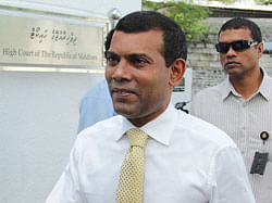 n this photograph taken on November 4, 2012, Former President of The Maldives, Mohamed Nasheed (C) arrives at a court appearance in Male. Police in the Maldives arrested opposition leader Mohamed Nasheed on March 5, 2013, defying pressure from regional power India which had called for him to be free to campaign for elections, his party said. AFP PHOTO