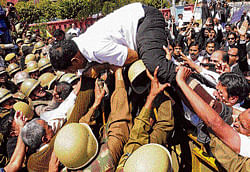 Police and advocates tussle outside the Rajasthan Assembly during the budget presentation in Jaipur on Wednesday. pti