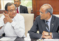 Finance Minister P Chidambaram (left) and RBI Governor D Subbarao confer in New Delhi on Friday. PTI