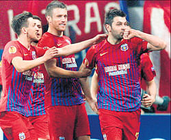 Steaua Bucharests Raul Rusescu (right) celebrates with team-mates after scoring against Chelsea in their Europa League match on Thursday. Reuters