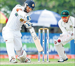 Kumar Sangakkara drives one en route his 142 against Bangladesh in Galle on Friday. AP