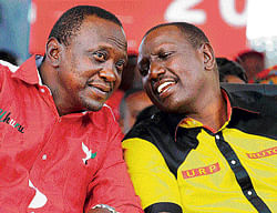 On electoral test: Kenyas Deputy Prime Minister and The National Alliance (TNA)  presidential candidate Uhuru Kenyatta (L) speaks with his running mate William Ruto during a  rally last Saturday. AFP file