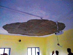 The damaged ceiling of a classroom in Nisarga Vidyanikethana  where a fan fell on children at Thyamagondlu on Friday. DH photo