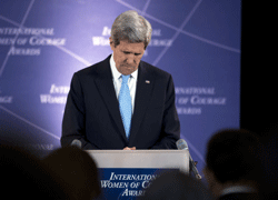 Secretary of State John Kerry, bows his head in a moment of silence, as Nirbhaya, which means fearless, the courageous 23-year-old victim of a brutal gang rape on a moving bus in Delhi is posthumously honored with the Secretary of States International Women of Courage Award at the State Department in Washington, Friday, March 8, 2013. (AP Photo