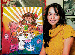 Artist Manvee Singh with a portrait of Goddess Saraswati, both a part of the Deity collection. PH
