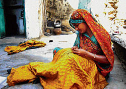 At work: An artisan plying her needle at her house in Dilwara. PHOTO by WFS