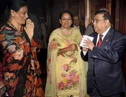 Chief Justice of India Justice Altamas Kabir exchange greeting with women judges as he arrives at a programme on the occasion of International Women's Day at Calcutta High Court in Kolkata on Saturday. PTI Photo