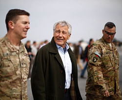 U.S. Defense Secretary Chuck Hagel arrives at Jalalabad Airfield in eastern Afghanistan, Saturday, March 9, 2013, escorted by U.S. Army Col. Joseph McGee, left, commander of the 1st Brigade, 101st Airborne. It is Hagel's first official trip since being sworn-in as President Barack Obama's defense secretary. AP Photo