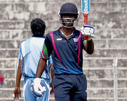 South zone player Baba Aparajit celebrate his century during the Deodhar Trophy 2013 played against East zone at Nehru stadium in Guwahati on Sunday. PTI Photo