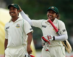 Bangladesh captain Mushfiqur Rahim, right, shares a light moment with batsman Mohammad Ashraful at the end of the third day of the first test cricket match between Sri Lanka and Bangladesh in Galle, Sri Lanka, Sunday, March 10, 2013. AP Photo