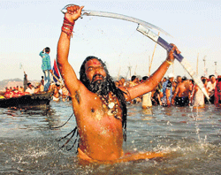 deep devotion: A sadhu takes a holy dip in the Ganga on the occasion of Mahashivratri,the last day of Kumbh mela, at Sangam in Allahabad on Sunday. PTI
