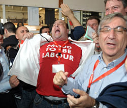 Labour supporters celebrate in the counting hall in Naxxar, after first samples taken indicate that the Labour Party had won the general election by a clear majority on March 10, 2013. Malta's opposition Labour party has won a general election for the first time in over 15 years, with party leader Joseph Muscat claiming a 'landslide victory' Sunday in the eurozone's smallest member. AFP PHOTO