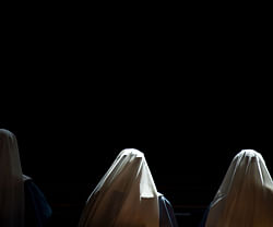 Nuns pray inside St Peter's basilica at the Vatican ahead of the cardinals conclave on March 10, 2013. Roman Catholic cardinals from around the world will assemble in the Vatican's Sistine Chapel from March 12, 2013 for a conclave to elect a new pope in an unprecedented transition after Benedict XVI's historic resignation. AFP PHOTO