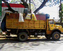Big block: The BBMPs Municipal Solid Waste transport vehicles are often loaded in the  middle of the road.