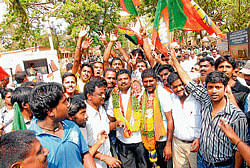 BJP candidates Bhujendra and Krishna celebrating their victory with the party workers in Chikmagalur on Monday.