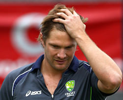 FILE - In this Dec. 13, 2012 file photo, Australia's cricket player Shane Watson pushes his hair back as he trains in Hobart. Australian cricket is unraveling. The public has been polarized by the decision to ban vice-captain Shane Watson and three other players for a test match for failing to submit a self-critique to the coaching staff on time. Watson left the tour hours after the ban was announced, saying hed be considering his future in cricket. He returned to Australia late Tuesday, March 12, 2013, to spend time with his heavily pregnant wife. AP Photo