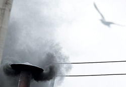 Black smoke rises from the chimney on the Sistine Chapel in Saint Peter's Square, indicating no decision has been made after the first voting session on the second day of the election of a new pope, at the Vatican, March 13, 2013. Roman Catholic Cardinals will continue their conclave meeting inside the Vatican's Sistine Chapel. REUTERS