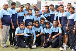 Players of West Zone pose with Deodhar Trophy after defeating North Zone in the final match at Nehru Stadium in Guwahati on Wednesday. PTI Photo