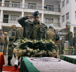 IGP Kashmir Abdul Gani Mir paying tributes to the five CRPF jawans who were killed in Wednesday's encounter with militants at Bemina, during a wreath laying ceremony in Srinagar on Thursday. PTI Photo