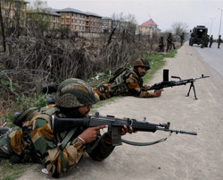 Soldiers take position during an encounter with millitants near a CRPF camp at Bemina in Srinagar on Wednesday. PTI Photo. FOR REPRESENTATION ONLY