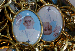 Keychains featuring newly-printed images of the newly-elected Pope Francis, Cardinal Jorge Mario Bergoglio of Argentina are displayed in a tourist shop near the Vatican in Rome, March 15, 2013. Pope Francis on Friday urged leaders of a Roman Catholic Church riven by scandal and crisis never to give in to discouragement and bitterness but to keep their eyes on their true mission. REUTERS