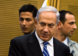 Israel's Prime Minister Benjamin Netanyahu (C) arrives to a Likud-Beitenu party meeting, at the Knesset, the Israeli parliament, in Jerusalem March 14, 2013. Netanyahu clinched deals for a coalition government on Thursday reflecting a shift to the centre in Israel and a domestic agenda that has shunted peacemaking with Palestinians to the sidelines. REUTERS