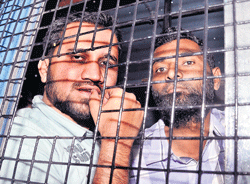 A file picture of two accused in the Bangalore terror module case being brought to the court.