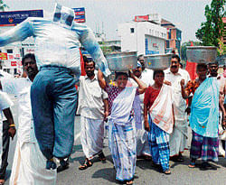 Fishermen and women demonstrate with an effigy of Prime Minister Manmohan Singh as they shout slogans against the ruling UPA government's mishandling of the Italian marines trial for murder, in Thiruvananthapuram.