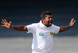 Sri Lankan cricketer Rangana Herath appeals during the opening day of their second Test cricket match between Sri Lanka and Bangladesh at the R. Premadasa Cricket Stadium in Colombo on March 16, 2013. AFP PHOTO