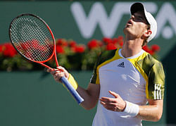 Andy Murray of Britain react to losing a point against Juan Martin Del Potro of Argentina during their men's singles quarterfinal match at the BNP Paribas Open ATP tennis tournament in Indian Wells, California, March 15, 2013. REUTERS
