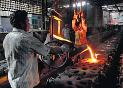MISSION IMPOSSIBLE: Workers tend to a furnace at a steel factory in the outskirts of Coimbatore, about 500 km from Chennai, January 7, 2013. Reuters