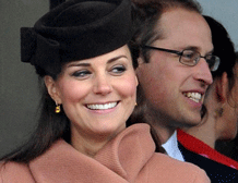 Kate, the Duchess of Cambridge, left, and her husband Prince William watch the first race of the Cheltenham Gold Cup Day at the Cheltenham Racecourse, Gloucestershire, England. AP photo