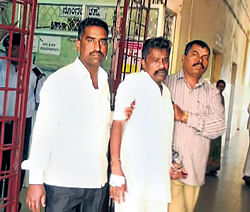 Forest brigand Veerappans accomplice, Simon Anthonyappa (centre) being taken to the district hospital for treatment in Belgaum on Sunday. DH Photo