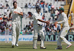 An Australian player shakes hands with Murli Vijay to appreciate his inning after he got out on the 4th day of the 3rd Test match in Mohali on Sunday. PTI Photo