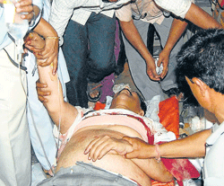 TIMELY HELP: Legislator C C Patil being rushed to a hospital in Hubli on Sunday night, after he suffered a bullet injury. DH Photo