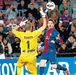 nice and easy Barcelonas Lionel Messi tries to score past Rayo Vallecano keeper Ruben during their La Liga tie. REUTERS