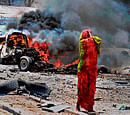 at a loss: A Somali woman reacts near the site of a car bomb in Mogadishu on Monday. AFP