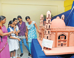 Different Visitors take a look at the Gol Gumbaz model.
