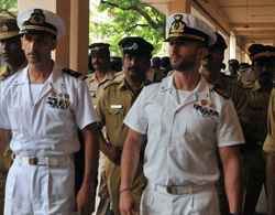 (FILES) In this photograph taken on May 25, 2012, Italian marines Latore Massimiliano (2L) and Salvatore Girone (2R) are escorted by Indian police outside a court in Kollam. Two Italian marines accused of murdering two fishermen appeared in an Indian court for a preliminary hearing on June 2, 2012, in a case that has caused a diplomatic row. The Italian foreign ministry on March 11, 2013 said the two Italian marines accused of killing two Indian fishermen they mistook for pirates would not return to India when their court-allowed leave runs out at the end of this month. AFP PHOTO