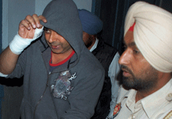 Accused of the heroin recovery case Anup Singh Kahlon comes out after medical check-up in a hospital in Patiala on Thursday. PTI Photo